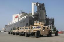 U.S. Marine Corps vehicles are staged for loading onto a ship. (Credit: Sgt. Alize Sotelo, USMC)